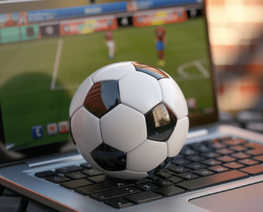 A soccer ball on a laptop